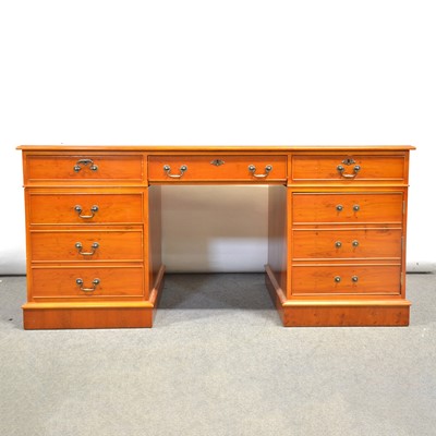 Lot 440 - Reproduction yew twin pedestal desk and a buttoned leather chair