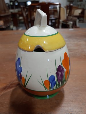 Lot 12 - Clarice Cliff, a 'Crocus' pattern daffodil preserve pot and cover