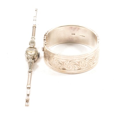 Lot 207 - A silver half hinged bangle and marcasite cocktail watch.