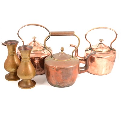 Lot 259 - Three copper kettles and a pair of Jones and Willis ecclesiastical brass vases.