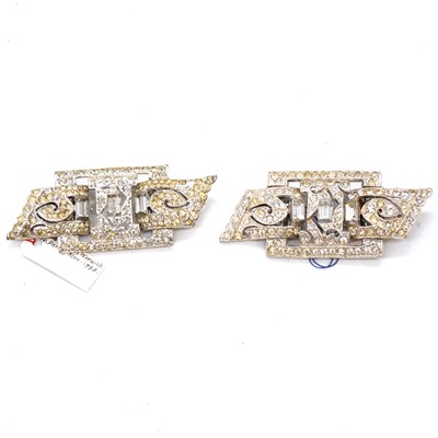 Lot 453 - Twenty-five Art Deco and later paste set duette dress clips.