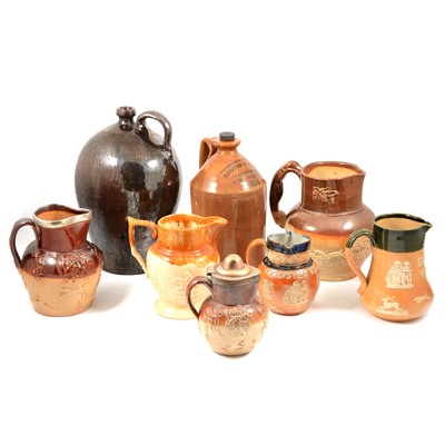 Lot 132 - A collection of Doulton stoneware harvest jugs and similar, Markham & Roberts ale flagon etc