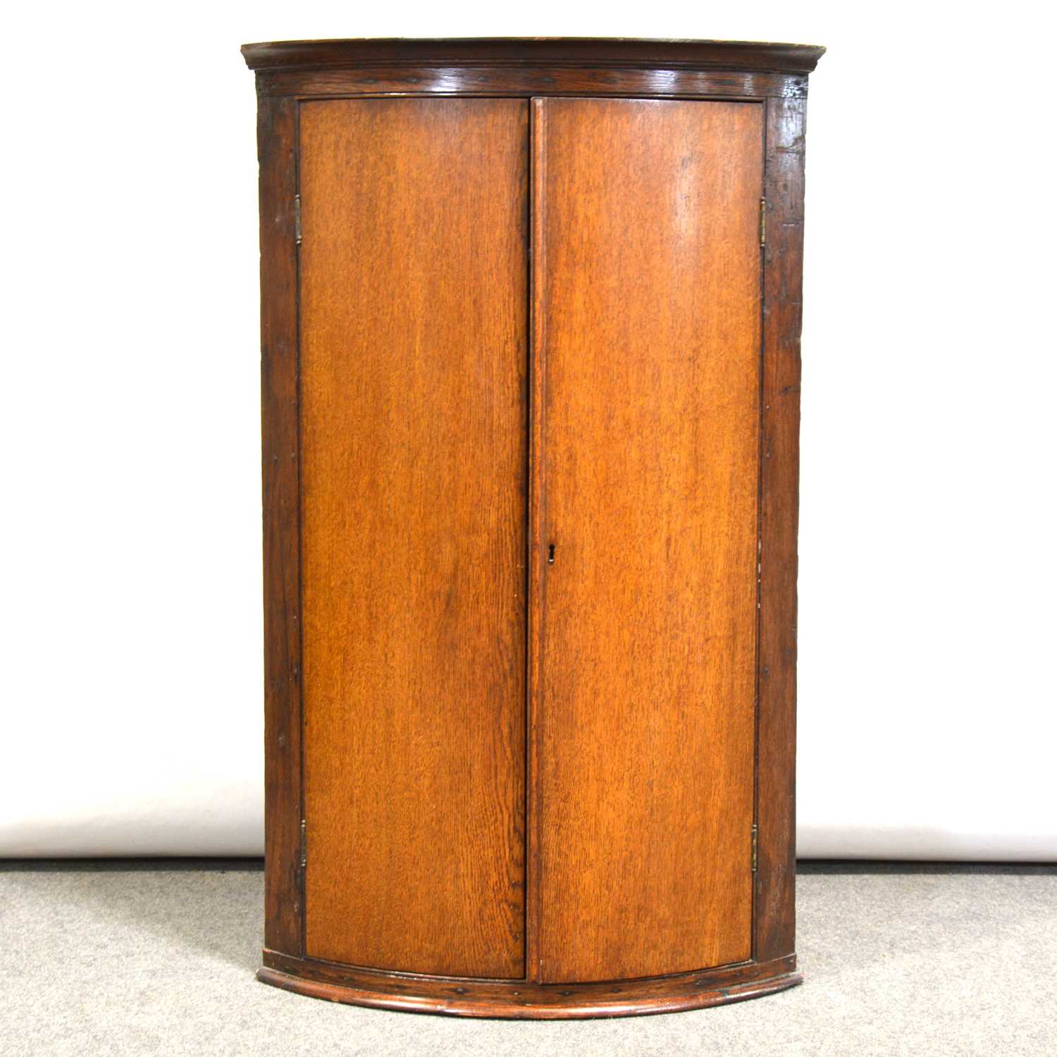 Lot 380 - Victorian oak cylinder-front hanging corner cupboard