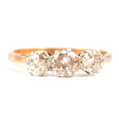 Lot 7 - A diamond three stone ring.