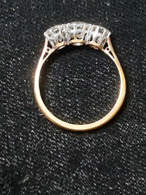 Lot 7 - A diamond three stone ring.