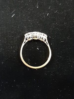 Lot 7 - A diamond three stone ring.