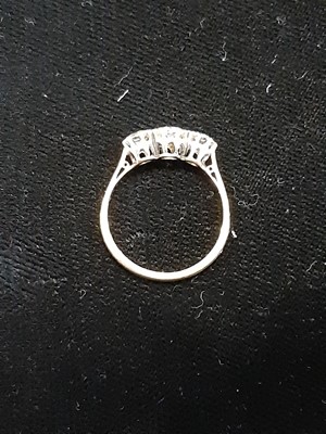 Lot 7 - A diamond three stone ring.
