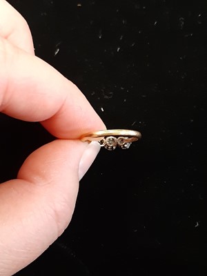 Lot 7 - A diamond three stone ring.