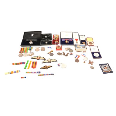 Lot 232 - A collection of medals, badges and awards relating to three main recipients.