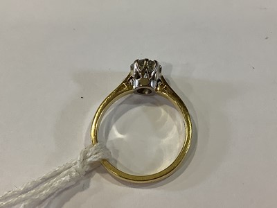 Lot 73 - A diamond solitaire ring.