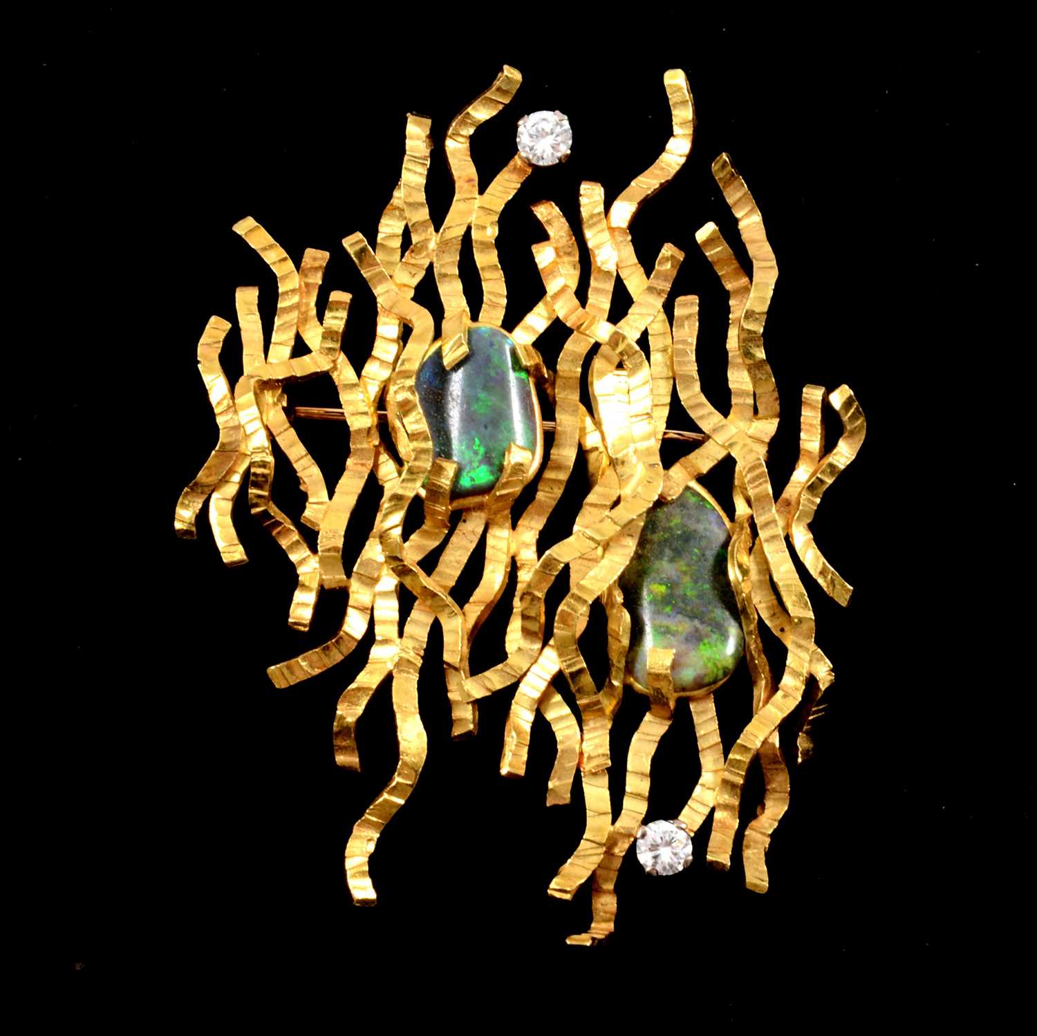 Lot 121 - Tom Payne and Peter Triggs - a 1960’s modernist 18 carat gold brooch.
