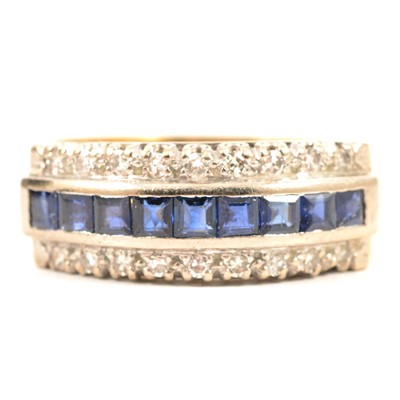 Lot 19A - A sapphire and diamond half hoop ring.