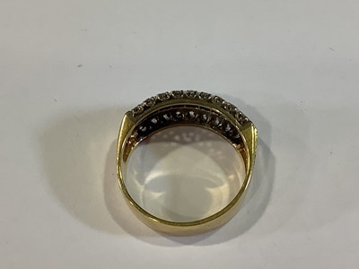 Lot 19 - A sapphire and diamond half hoop ring.