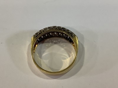 Lot 19 - A sapphire and diamond half hoop ring.