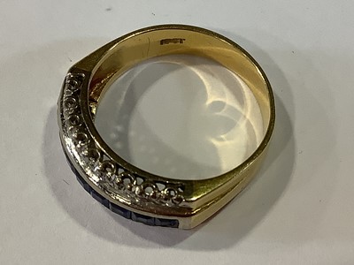 Lot 19 - A sapphire and diamond half hoop ring.