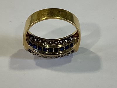Lot 19 - A sapphire and diamond half hoop ring.