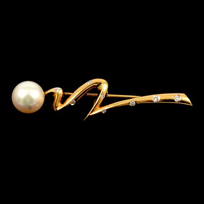 Lot 213 - A modern cultured pearl and diamond brooch.