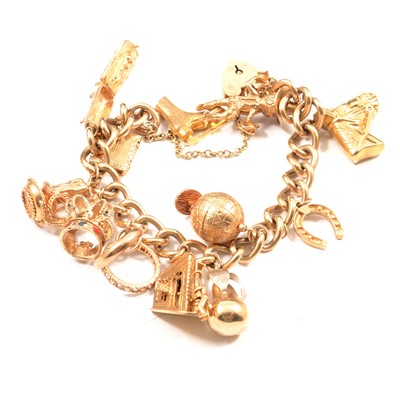 Lot 75A - A gold charm bracelet and charms.