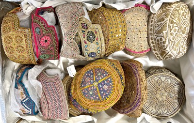 Lot 21 - Collection of embroidered hats from Kutch, Gujarat, and Afghanistan