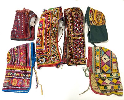 Lot 28 - Collection of seventeen hoods and bonnets, India and the Indian subcontinent