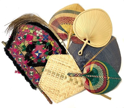 Lot 33 - Collection of woven Ethnic rigid fans, and a fly whist