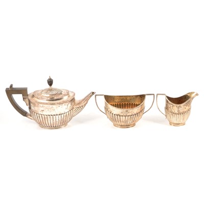 Lot 221 - Silver three piece tea set, matched