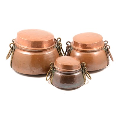 Lot 176 - Three graduated Burmese copper cooking pots, with lids.