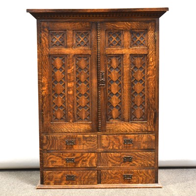 Lot 358 - Oak side cabinet, two doors with blind fretwork, over six drawers.