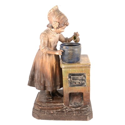 Lot 110 - Large Austrian terracotta model of a girl at a stove, early 20th century