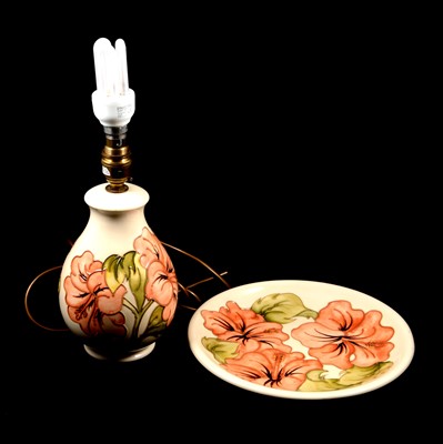 Lot 21 - Moorcroft Pottery, a 'Hibiscus' lamp base, and a plate