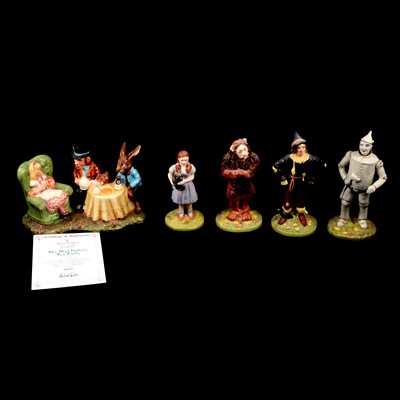 Lot 8 - Royal Doulton Wizard of Oz figurines and a Doulton-Beswick Mad Hatter's Tea Party group