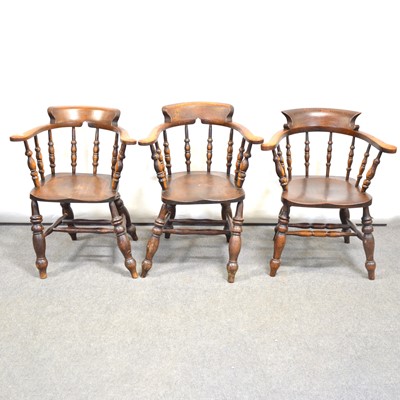 Lot 397 - Five elm beech and fruitwood hoop back club chairs