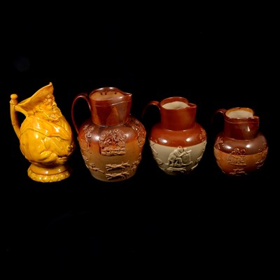 Lot 83 - Three Doulton Lambeth stoneware jugs, and a relief-ware jug modelled as a jolly sailor