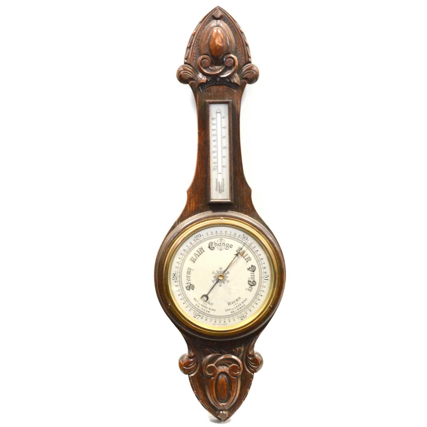 Lot 388 - Carved oak aneroid barometer