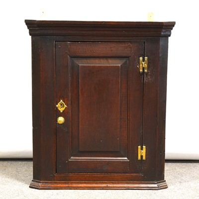 Lot 359 - George III oak hanging corner cupboard