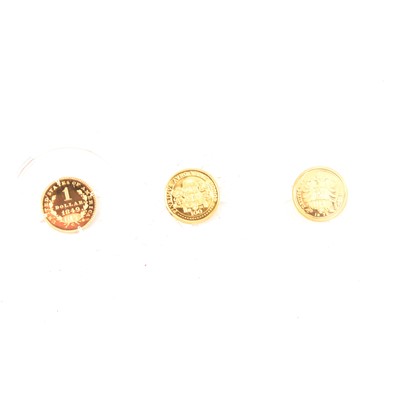Lot 231 - A 14 carat gold proof replica of the 1849-C Liberty Dollar, and two 8 carat gold coins.