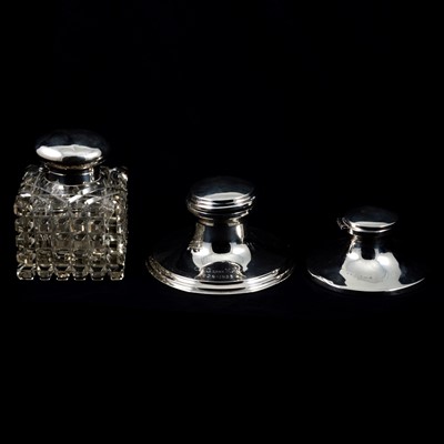 Lot 245 - Two silver capstan inkwells and a large silver-mounted glass jar.