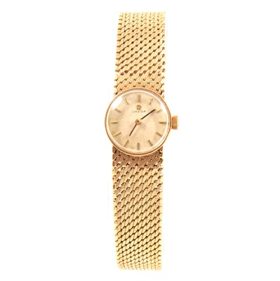 Lot 347 - Omega - a lady's 9 carat yellow gold bracelet wristwatch.