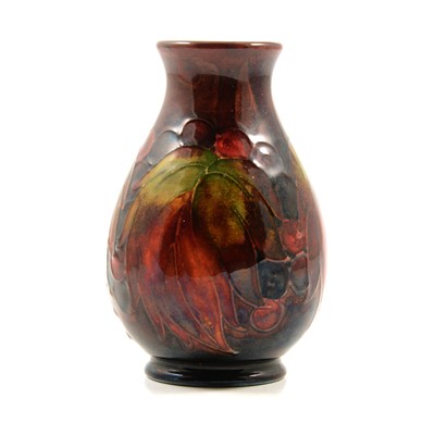 Lot 523 - Moorcroft Pottery, a flambe 'Leaf and Berry' design vase
