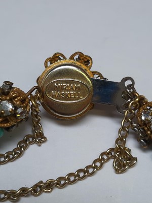 Lot 383 - Miriam Haskell - a signed faux turquoise, paste and gilt metal necklace and bracelet suite.