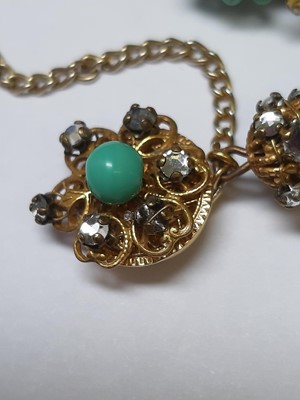 Lot 383 - Miriam Haskell - a signed faux turquoise, paste and gilt metal necklace and bracelet suite.
