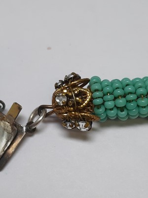 Lot 383 - Miriam Haskell - a signed faux turquoise, paste and gilt metal necklace and bracelet suite.