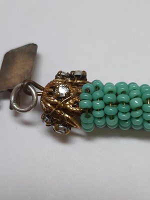 Lot 383 - Miriam Haskell - a signed faux turquoise, paste and gilt metal necklace and bracelet suite.