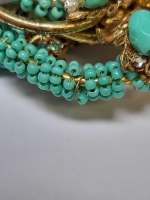 Lot 383 - Miriam Haskell - a signed faux turquoise, paste and gilt metal necklace and bracelet suite.