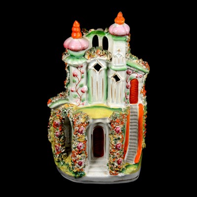 Lot 56 - A collection of Staffordshire flatback figures and buildings.