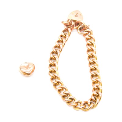 Lot 178 - A yellow metal hollow curb link bracelet and heart charm.