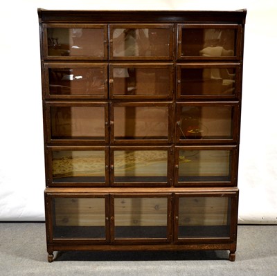 Lot 427 - Globe Wernicke style oak four-height sectional bookcase