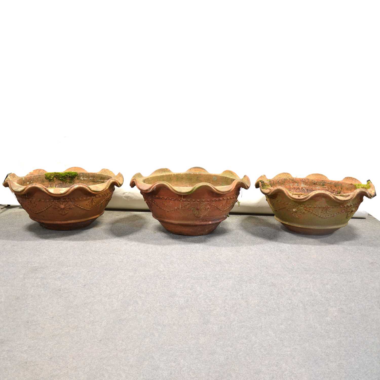 Lot 512 - Set of three terracotta shallow garden planters