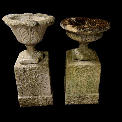 Lot 509 - Two garden urns on pair of rectangular plinth