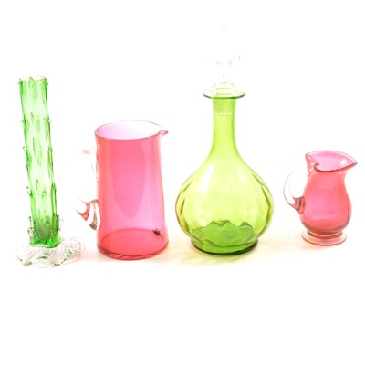 Lot 65 - Collection of cranberry glass and green glass decanters and stemware